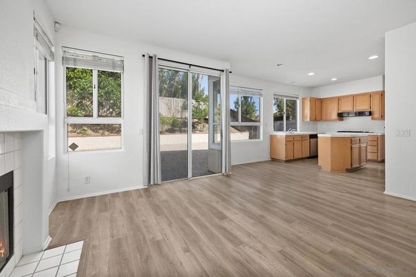 Empty room, Fireplace, Interior, Kitchen, Recessed Lighting, Wood Texture Flooring