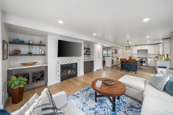 Fireplace, Interior, Kitchen, Living room, Pendant Lights, Recessed Lighting, Stainless Steel Appliances, Wood Texture Flooring