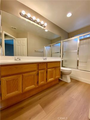 Bathroom, Dual Sink Vanities, Glass Shower, Interior, Recessed Lighting, Wood Texture Flooring