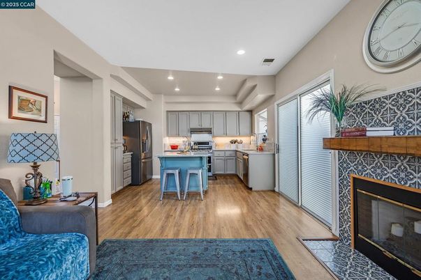 Fireplace, Interior, Kitchen, Recessed Lighting, Stainless Steel Appliances, Wood Texture Flooring