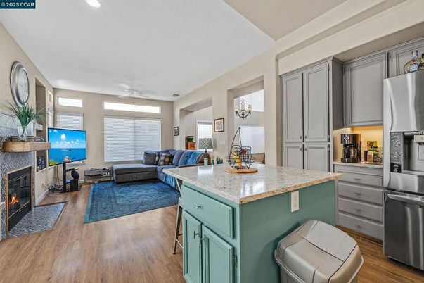 Fireplace, Interior, Kitchen, Living room, Recessed Lighting, Water, Wood Texture Flooring