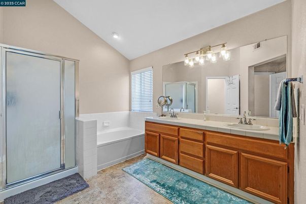 Bathroom, Dual Sink Vanities, Interior, Recessed Lighting, Tile Countertops
