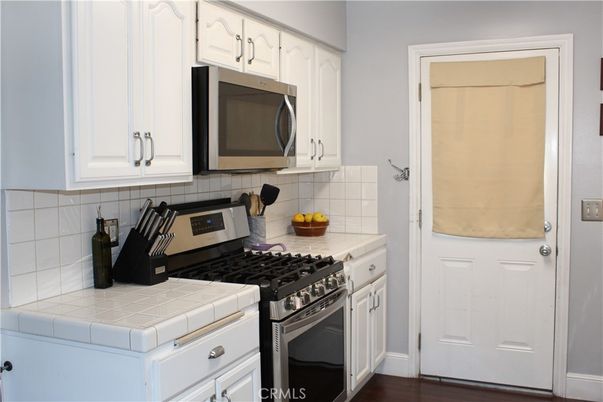 Interior, Kitchen, Tile Countertops, Wood Texture Flooring