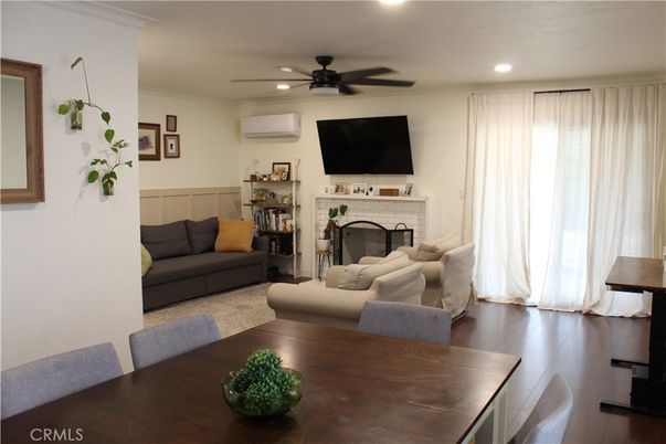 Dining room, Fireplace, Interior, Living room, Recessed Lighting, Wood Texture Flooring