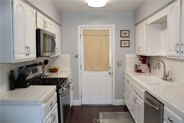 Interior, Kitchen, Tile Countertops, Wood Texture Flooring