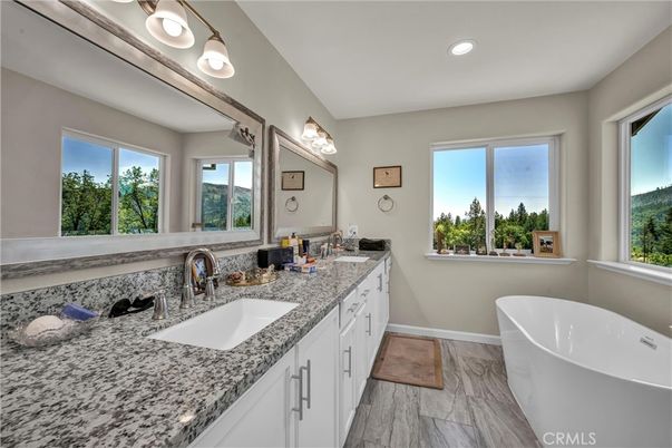 Bathroom, Dual Sink Vanities, Free Standing Baths, Interior, Marble, Recessed Lighting, Wood Texture Flooring