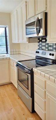 Interior, Kitchen, Tile Countertops, Wood Texture Flooring