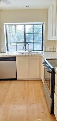 Interior, Kitchen, Tile Countertops, Wood Texture Flooring