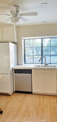 Interior, Kitchen, Tile Countertops, Wood Texture Flooring
