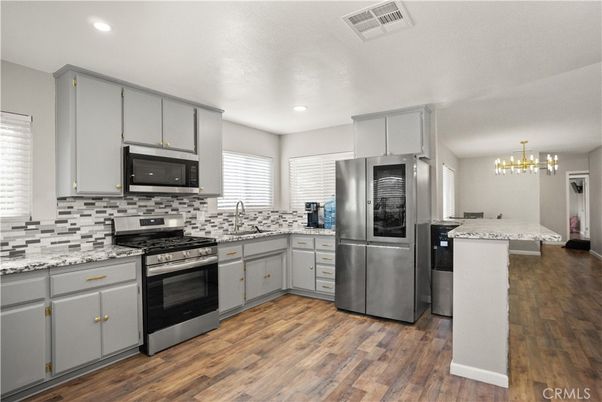 Chandelier, Interior, Kitchen, Pendant Lights, Recessed Lighting, Stainless Steel Appliances, Wood Texture Flooring