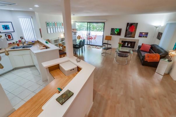 Dining room, Fireplace, Interior, Living room, Pendant Lights, Recessed Lighting, Wood Texture Flooring