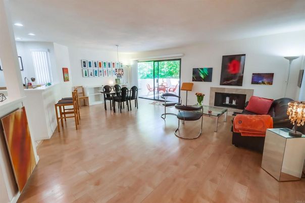 Chandelier, Dining room, Fireplace, Interior, Living room, Pendant Lights, Recessed Lighting, Wood Texture Flooring