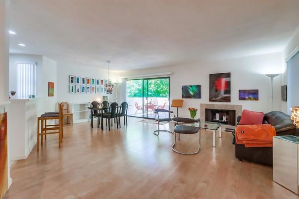 Chandelier, Dining room, Fireplace, Interior, Living room, Pendant Lights, Recessed Lighting, Wood Texture Flooring