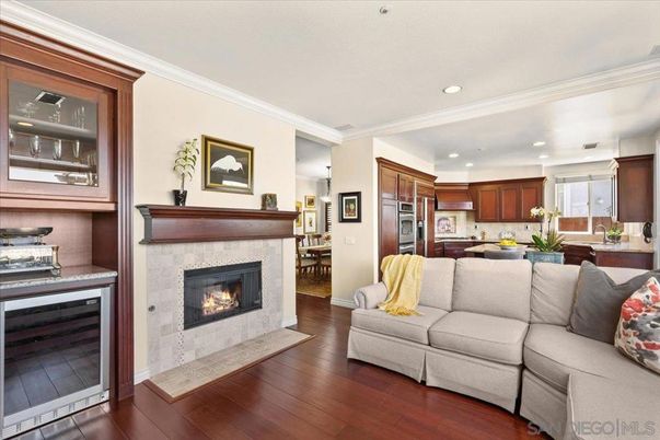 Dining room, Fireplace, Interior, Kitchen, Living room, Recessed Lighting, Stainless Steel Appliances, Wood Texture Flooring