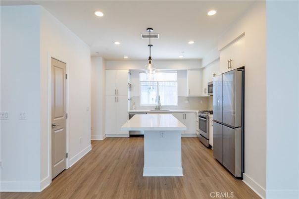 Interior, Kitchen, Pendant Lights, Recessed Lighting, Stainless Steel Appliances, Wood Texture Flooring