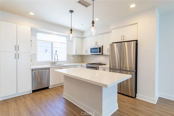 Interior, Kitchen, Pendant Lights, Recessed Lighting, Stainless Steel Appliances, Wood Texture Flooring