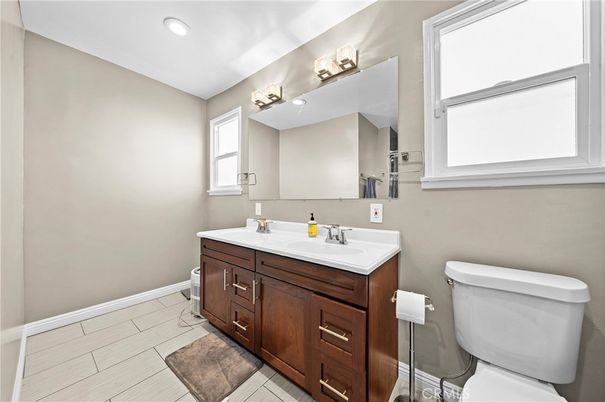 Bathroom, Dual Sink Vanities, Interior, Recessed Lighting, Wood Texture Flooring