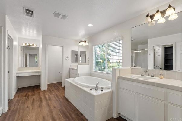 Bathroom, Dual Sink Vanities, Interior, Recessed Lighting, Tile Countertops, Wood Texture Flooring