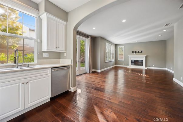Empty room, Fireplace, Interior, Kitchen, Recessed Lighting, Wood Texture Flooring