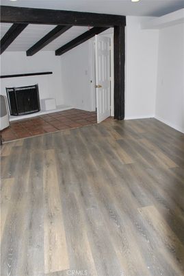Empty room, Fireplace, Interior, Recessed Lighting, Wooden Beams, Wood Texture Flooring