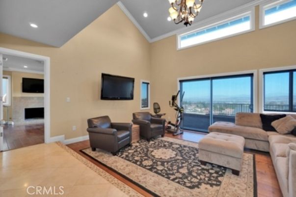 Chandelier, Fireplace, Fitness Equipment, Interior, Living room, Recessed Lighting, Wood Texture Flooring