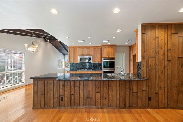 Chandelier, Interior, Kitchen, Recessed Lighting, Stainless Steel Appliances, Wood Texture Flooring