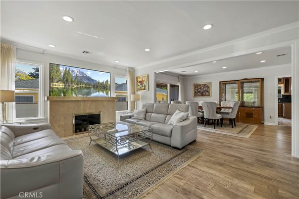 Dining room, Fireplace, Interior, Living room, Recessed Lighting, Wood Texture Flooring