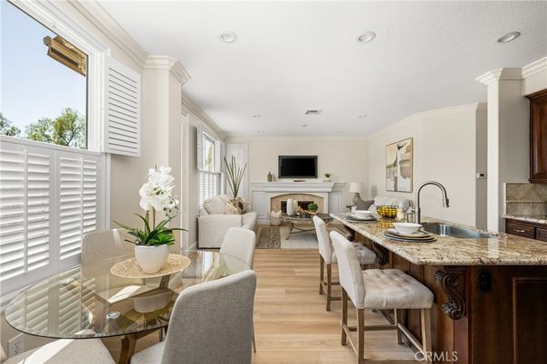 Dining room, Fireplace, Interior, Living room, Recessed Lighting, Wood Texture Flooring