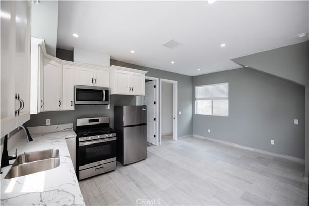 Interior, Kitchen, Recessed Lighting, Stainless Steel Appliances, Wood Texture Flooring
