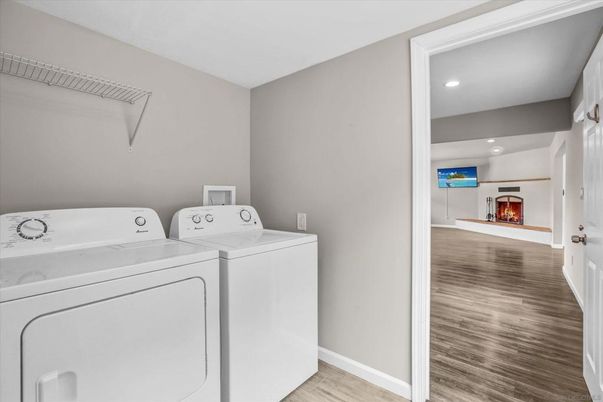 Fireplace, Interior, Recessed Lighting, Utility Closets, Washer, Wood Texture Flooring