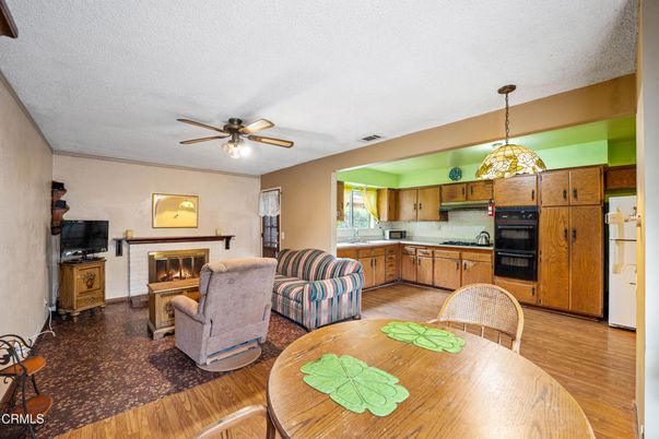 Dining room, Fireplace, Interior, Kitchen, Living room, Pendant Lights, Wood Texture Flooring