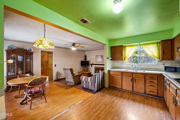 Dining room, Fireplace, Interior, Kitchen, Pendant Lights, Wood Texture Flooring