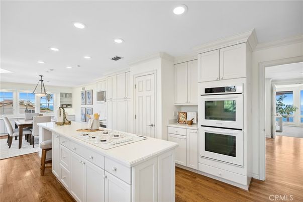 Dining room, Interior, Kitchen, Pendant Lights, Recessed Lighting, Stainless Steel Appliances, Water, Wood Texture Flooring