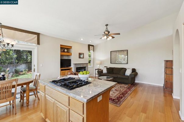 Dining room, Fireplace, Interior, Kitchen, Living room, Recessed Lighting, Wood Texture Flooring