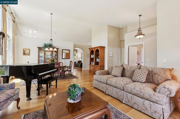 Dining room, Interior, Living room, Pendant Lights, Piano, Recessed Lighting, Wood Texture Flooring