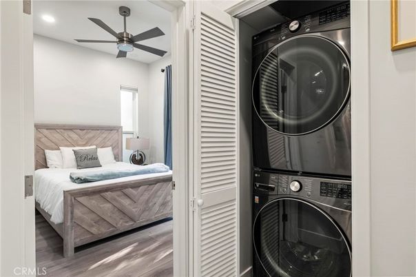 Bedroom, Interior, Recessed Lighting, Utility Closets, Washer, Wood Texture Flooring