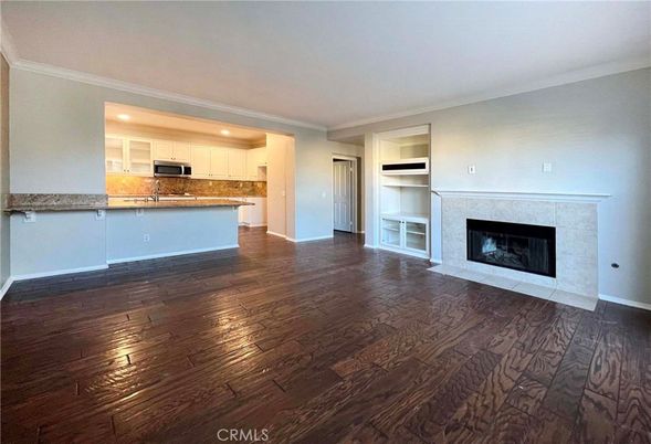 Empty room, Fireplace, Interior, Kitchen, Recessed Lighting, Wood Texture Flooring