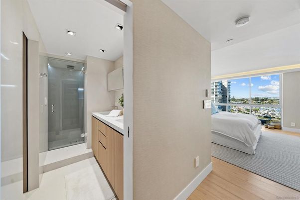 Bathroom, Bedroom, Glass Shower, Interior, Recessed Lighting, Water, Wood Texture Flooring