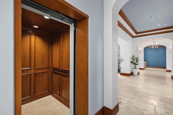 Chandelier, Elevator, Interior, Recessed Lighting, Wooden Walls