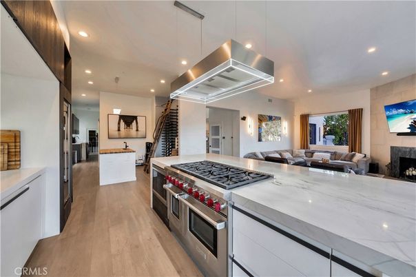 Fireplace, Interior, Kitchen, Living room, Pendant Lights, Recessed Lighting, Stainless Steel Appliances, Wood Texture Flooring