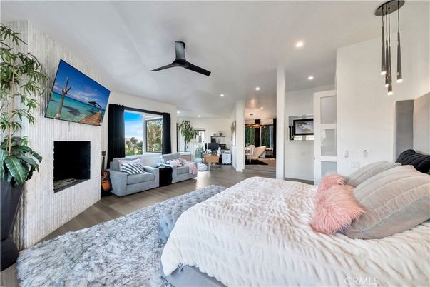 Bedroom, Fireplace, Interior, Pendant Lights, Recessed Lighting, Wood Texture Flooring