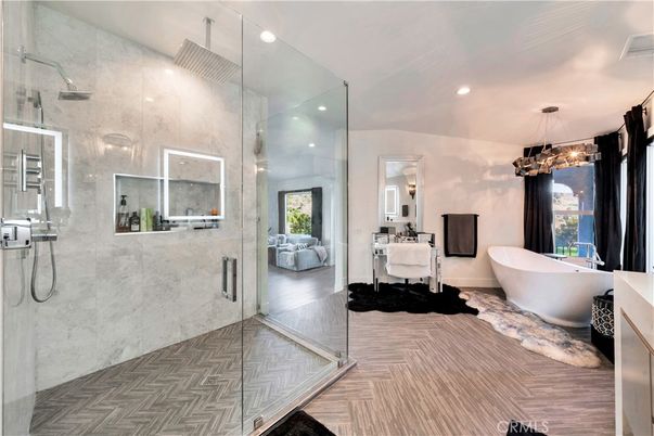 Bathroom, Free Standing Baths, Glass Shower, Interior, Marble Walls, Pendant Lights, Recessed Lighting, Wood Texture Flooring