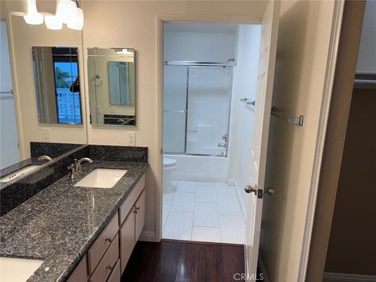 Bathroom, Dual Sink Vanities, Glass Shower, Interior, Wood Texture Flooring