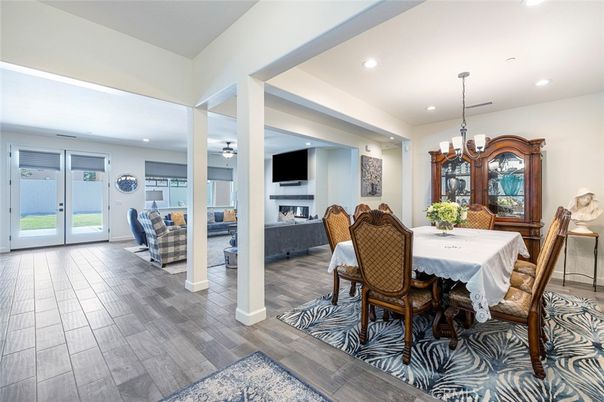 Chandelier, Dining room, Fireplace, Interior, Living room, Recessed Lighting, Wood Texture Flooring