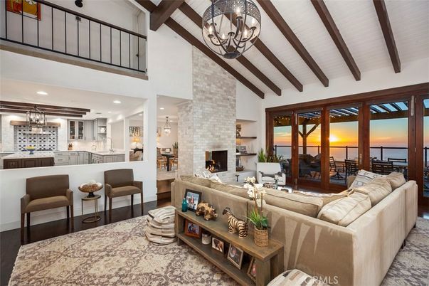 Chandelier, Fireplace, Interior, Kitchen, Living room, Recessed Lighting, Stone Walls, Water, Wooden Beams