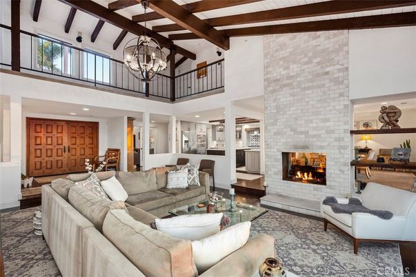 Chandelier, Fireplace, Interior, Living room, Recessed Lighting, Stone Walls, Wooden Beams