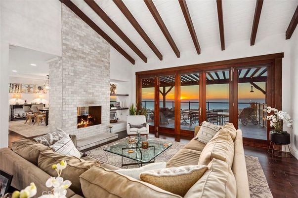 Dining room, Fireplace, Interior, Living room, Pendant Lights, Recessed Lighting, Stone Walls, Water, Wooden Beams, Wood Texture Flooring