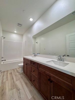 Bathroom, Dual Sink Vanities, Interior, Recessed Lighting, Wood Texture Flooring