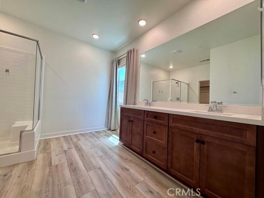 Bathroom, Dual Sink Vanities, Interior, Recessed Lighting, Wood Texture Flooring