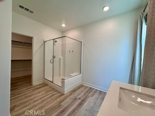 Bathroom, Glass Shower, Interior, Recessed Lighting, Walk-in Closets, Wood Texture Flooring